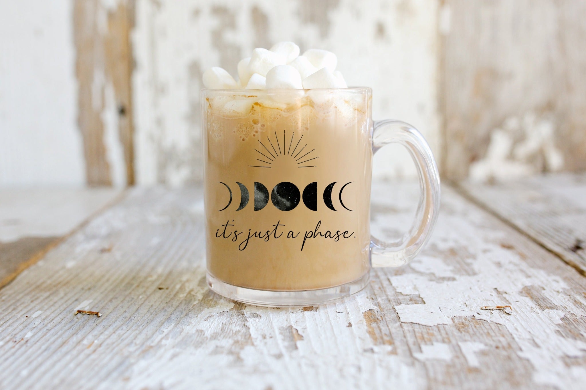 It's just a phase glass mug with marshmallows